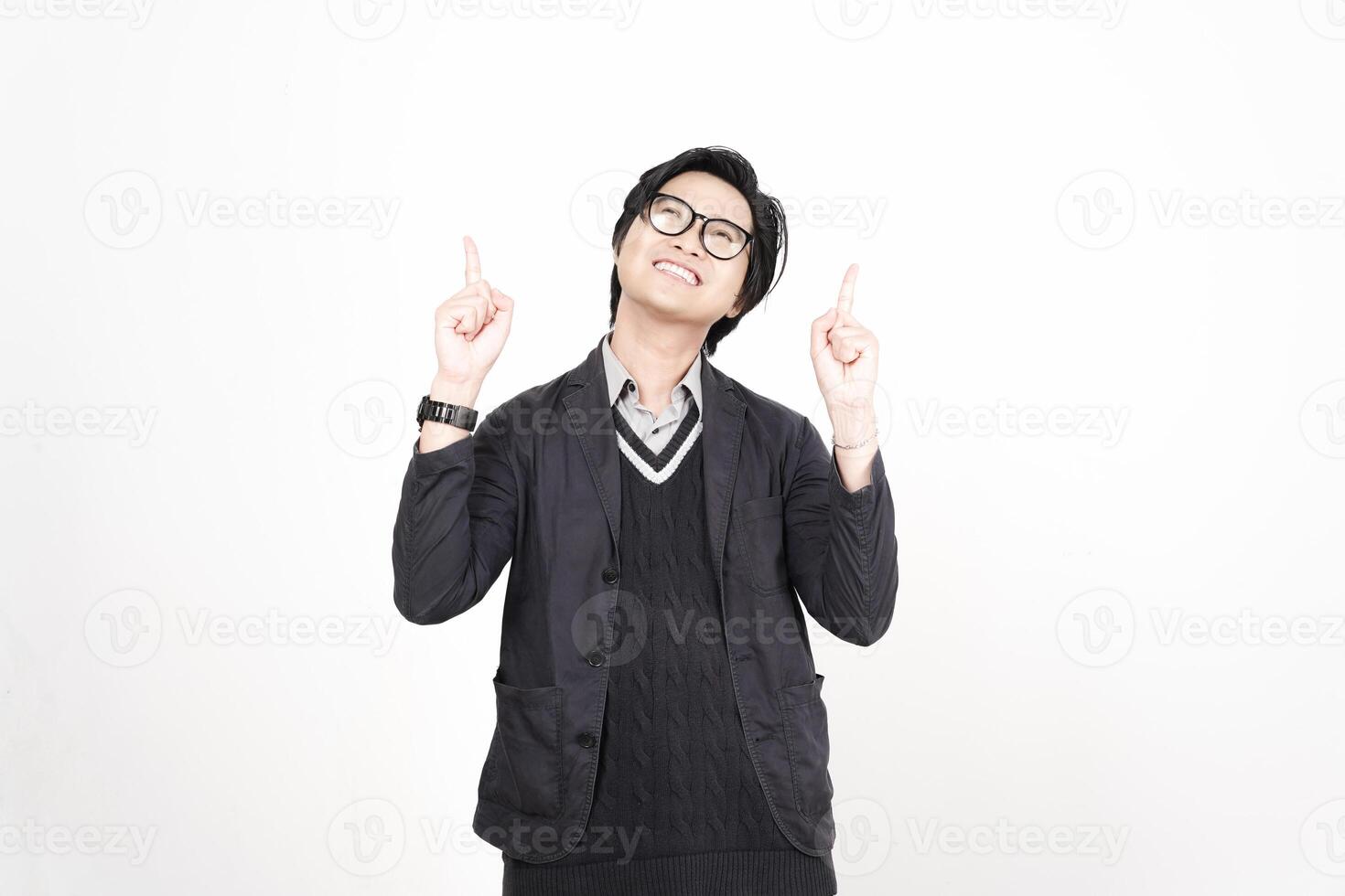 A man in glasses and a jacket is pointing up photo