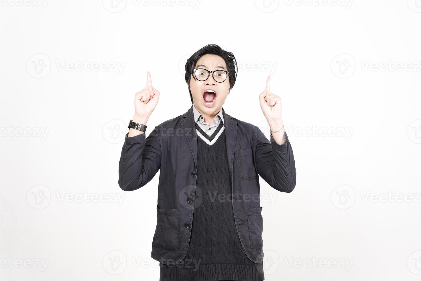 A man in glasses and a sweater is making a gesture photo