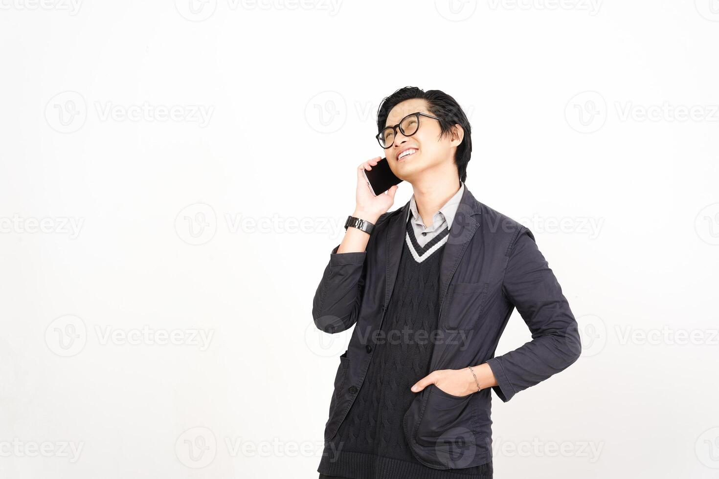 Asian man in suit talking on cell phone photo