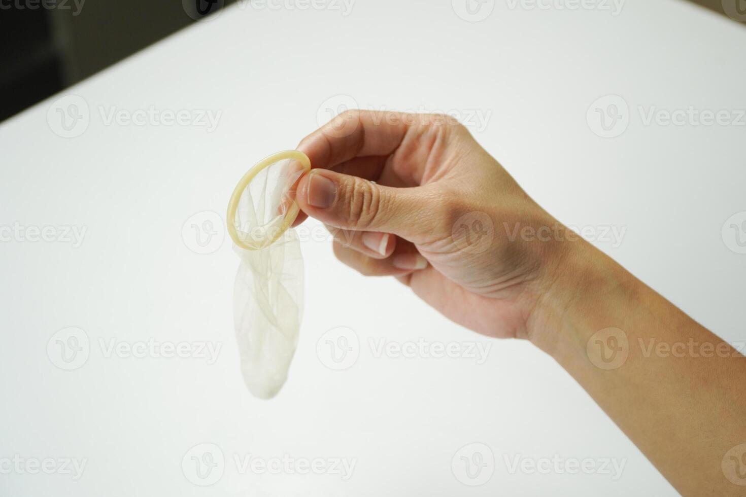 A person holding a small piece of plastic photo