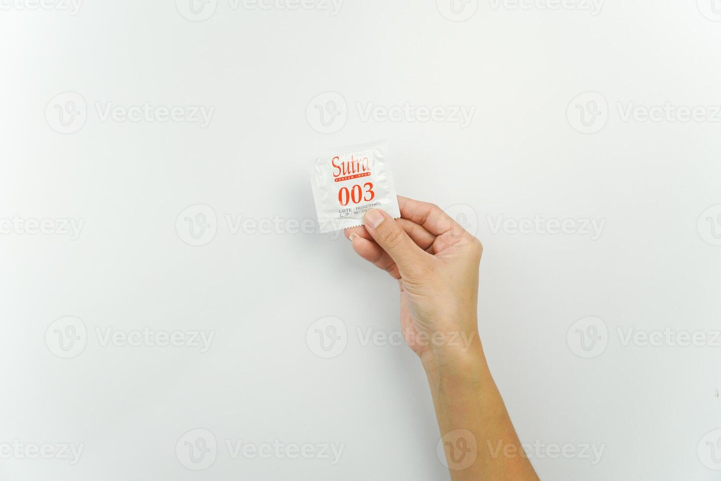 A person holding a small piece of paper with the word salve on it photo
