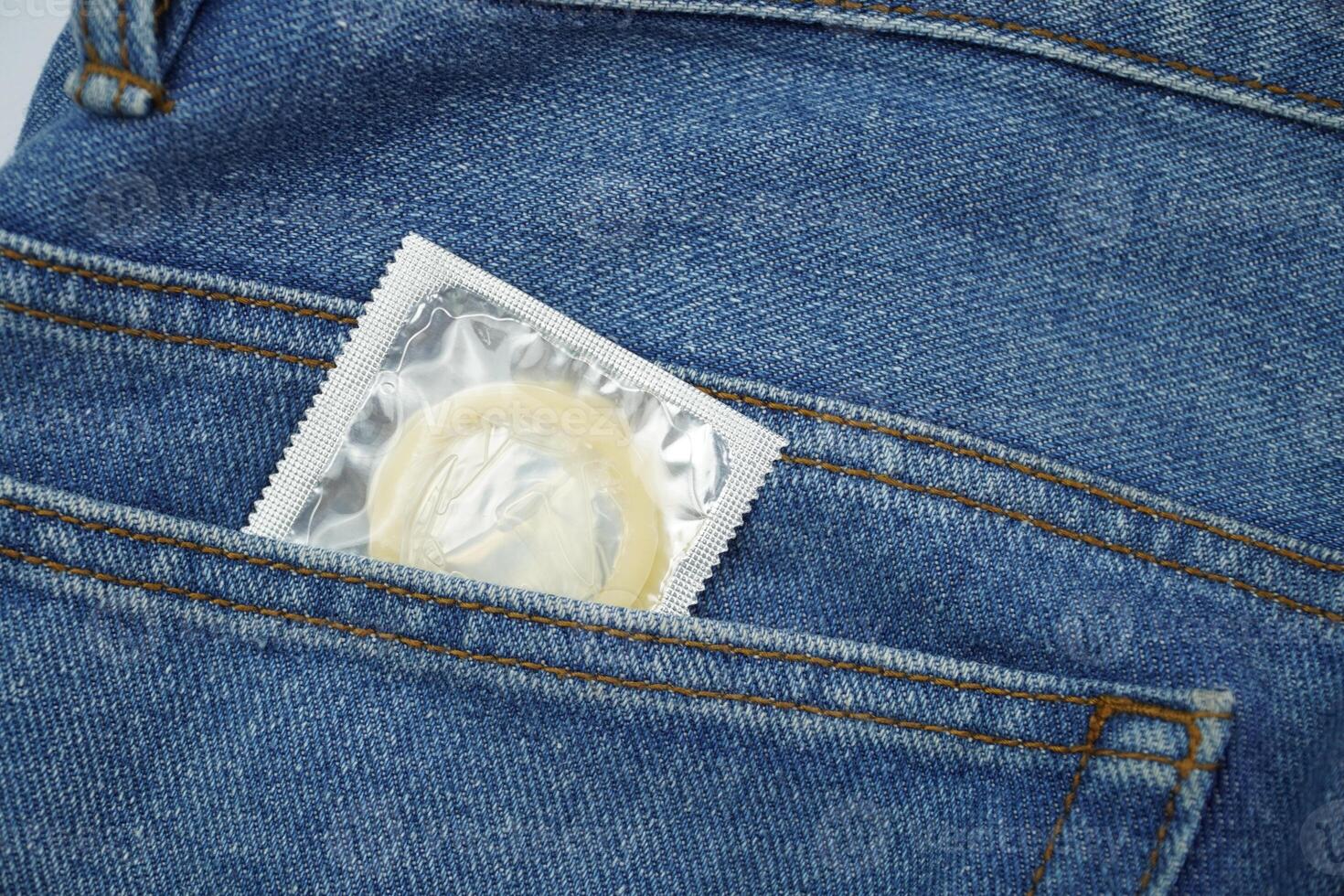 Condom in jeans pocket photo