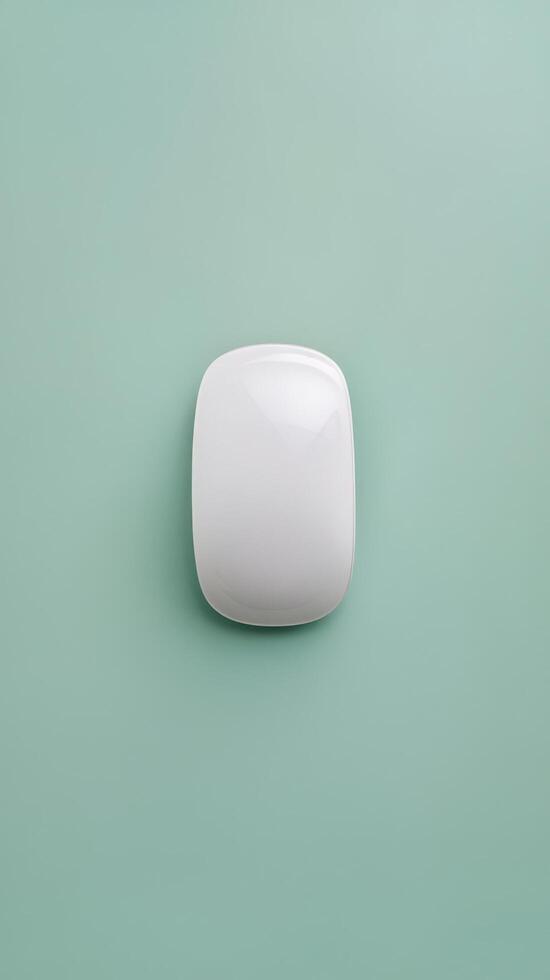 A white square light bulb on a green background photo