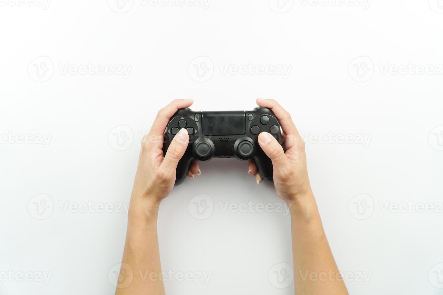 Hands holding a game controller on a white background photo