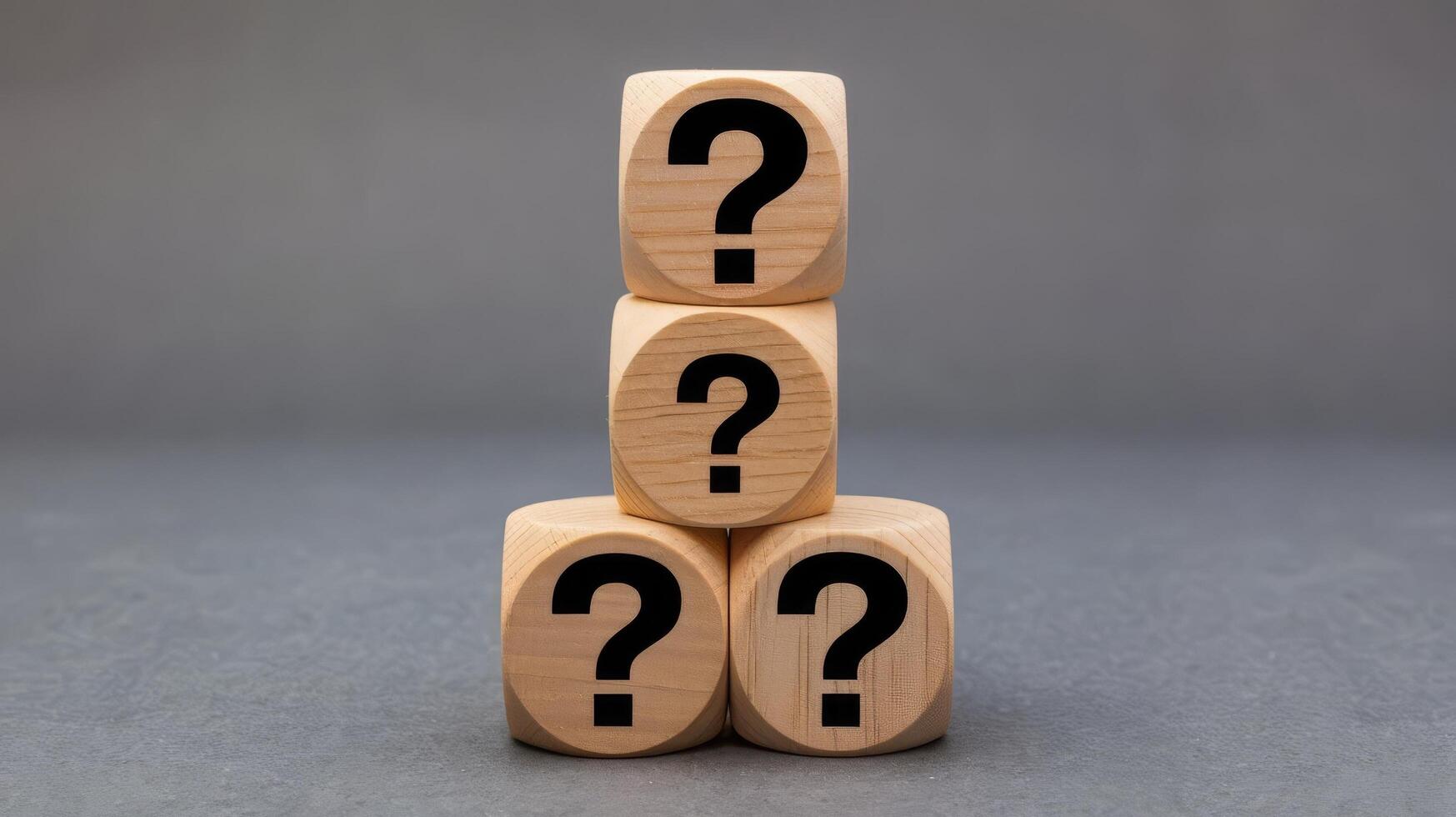 Wooden blocks with question marks on them photo