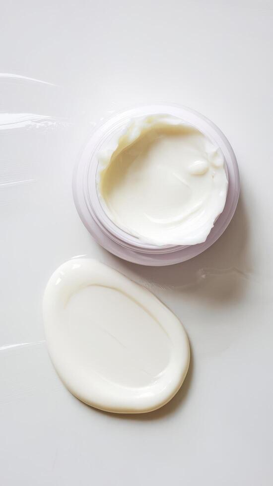 Face or body white cream drop or swipe hr balm lotion isolated on white background photo