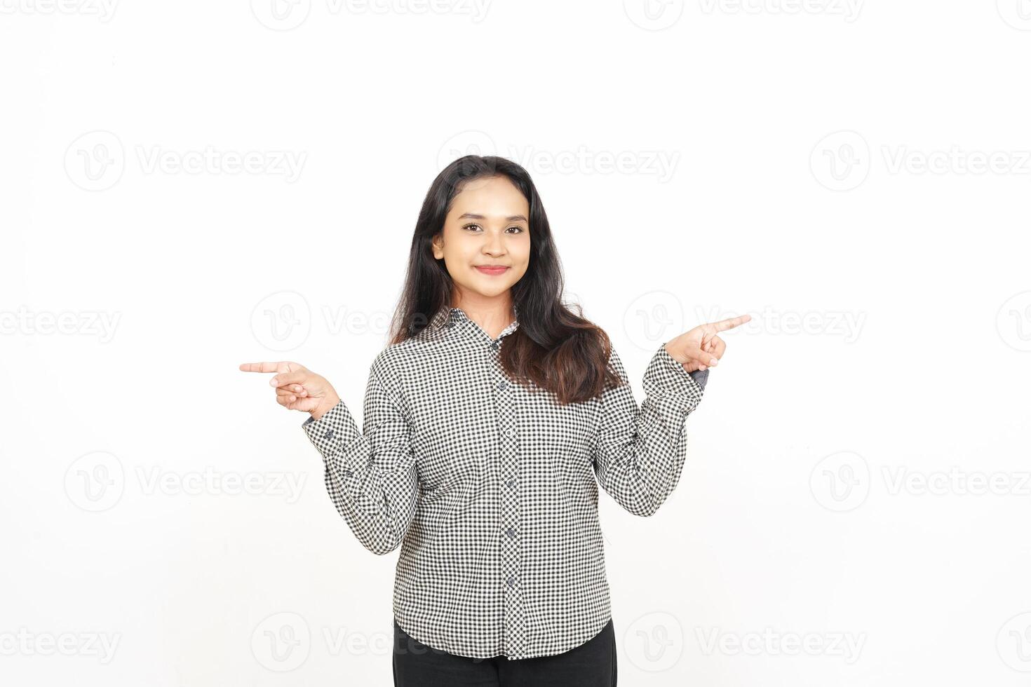 A woman in a shirt pointing at something photo
