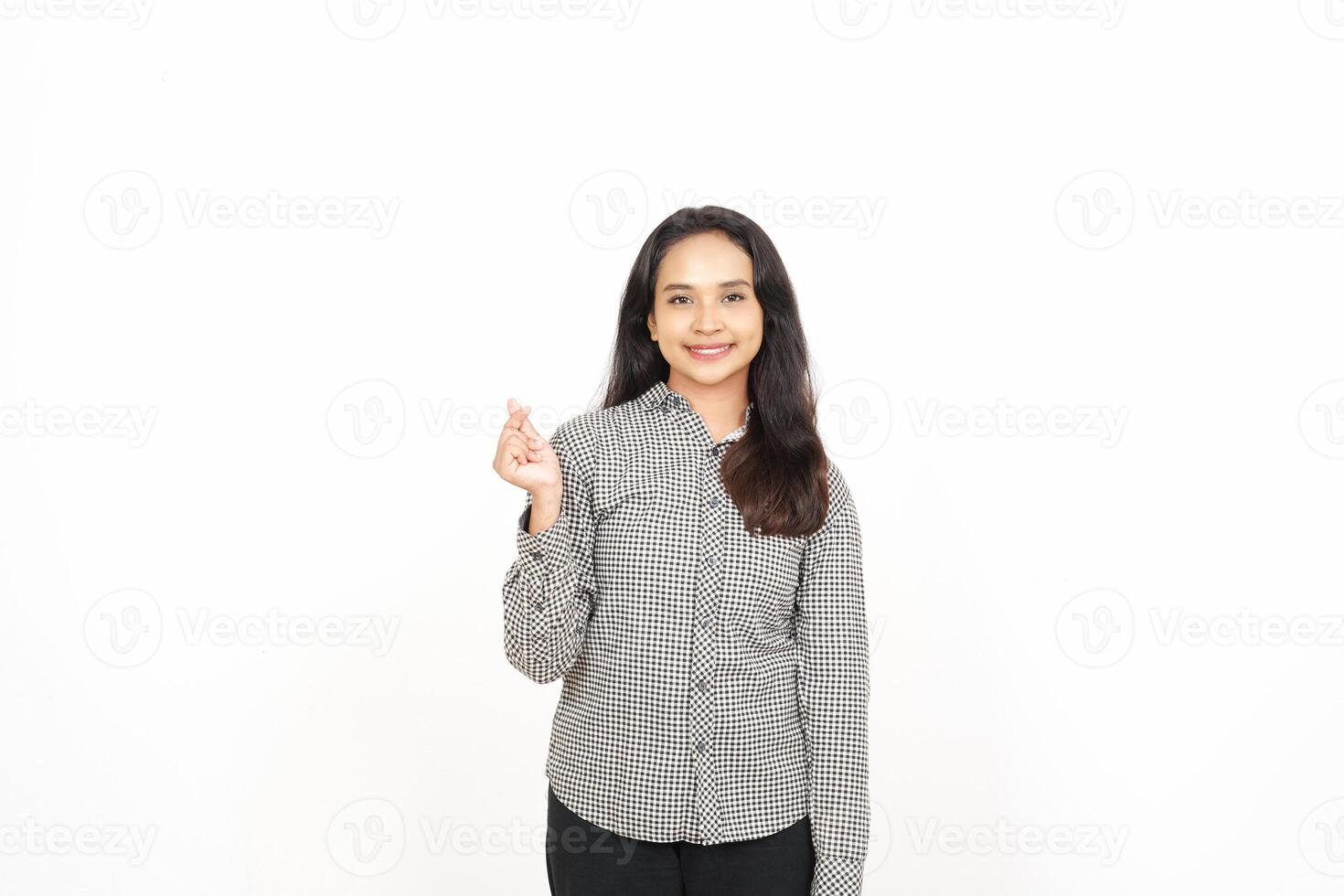 A woman in a shirt and pants is holding up her hand photo