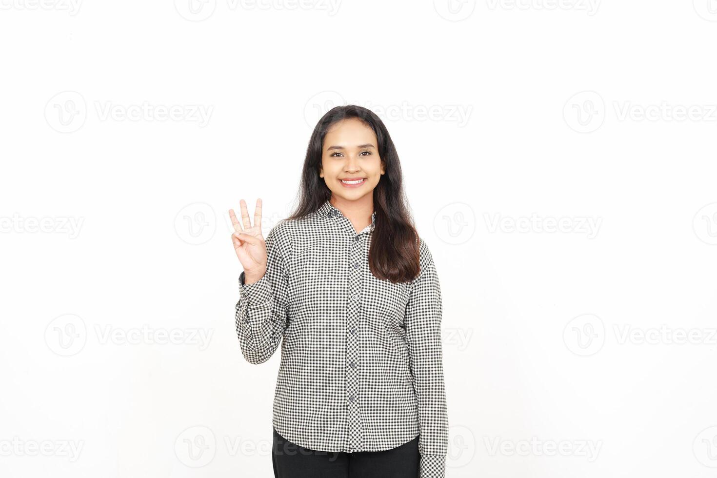 A woman in a shirt and pants is making a peace sign photo