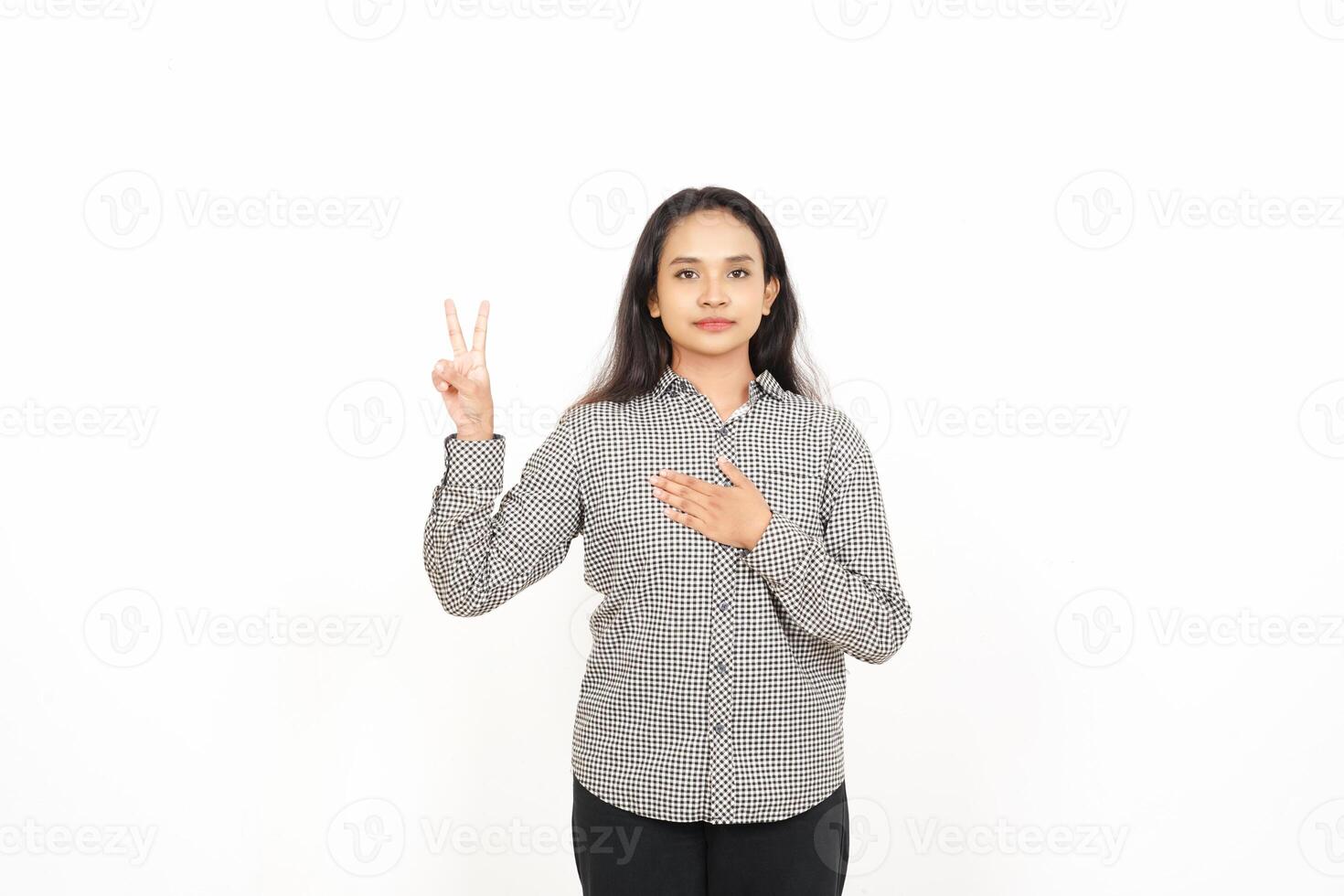 A woman making a peace sign with her hands photo