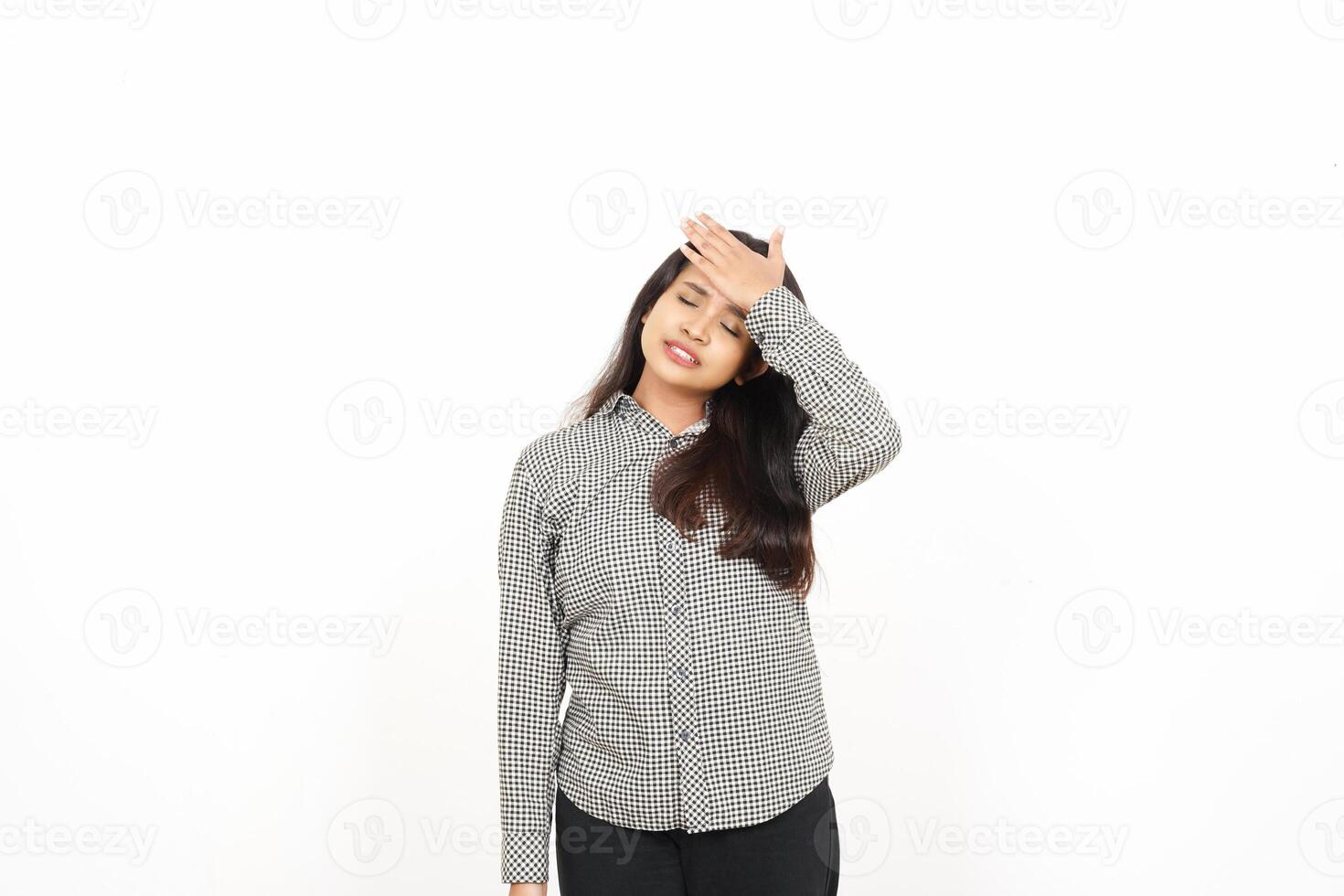 A woman is standing with her hands on her head photo