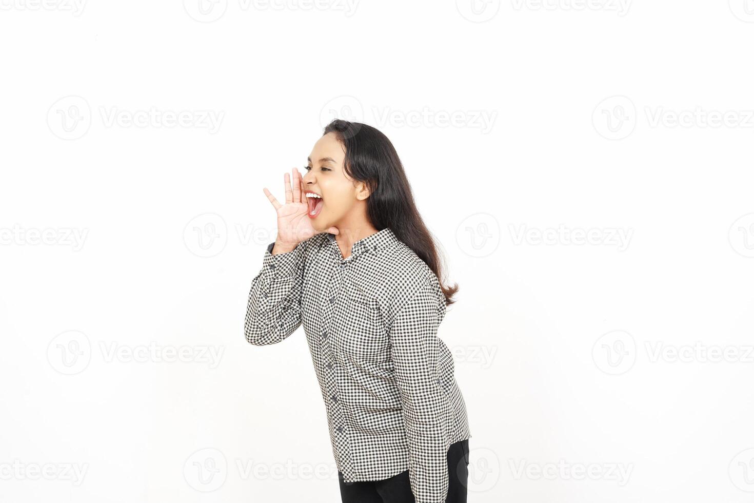 A woman is standing with her hands on her ears photo