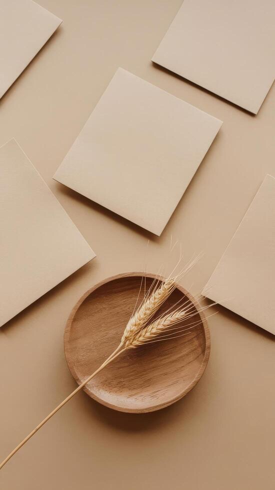 A bowl with wheat and paper on a table photo