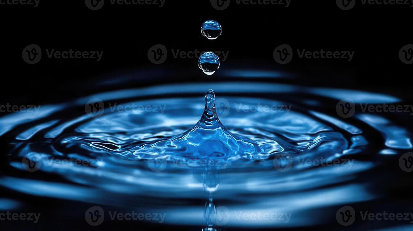 Water droplets in blue water photo
