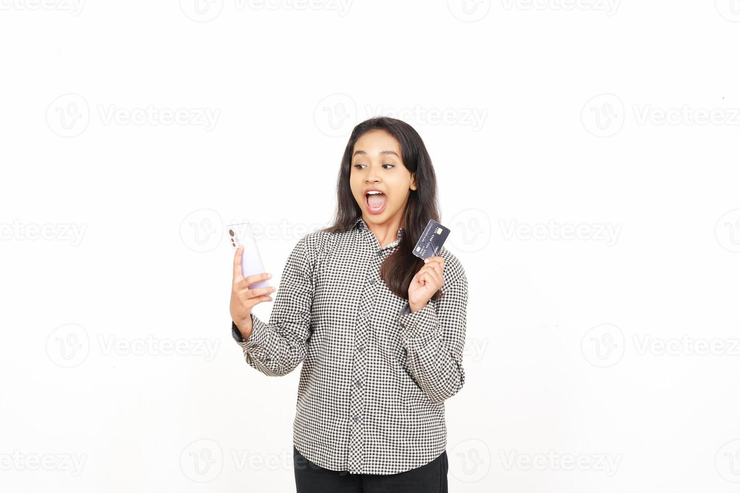 A woman holding a cell phone and a credit card photo