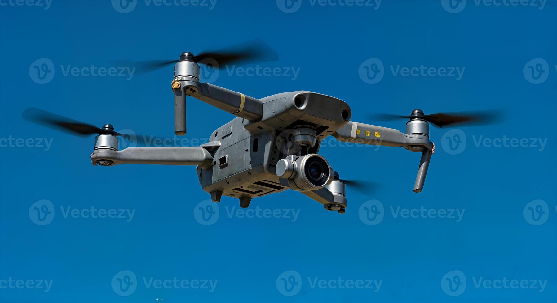 Modern Gray Drone Flying High in Clear Blue Sky Aerial Photography Pro Image Camera Flight photo