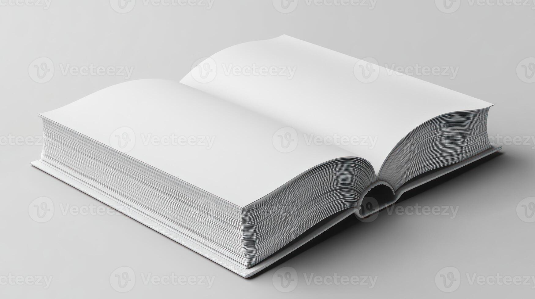 An open book on a white surface photo