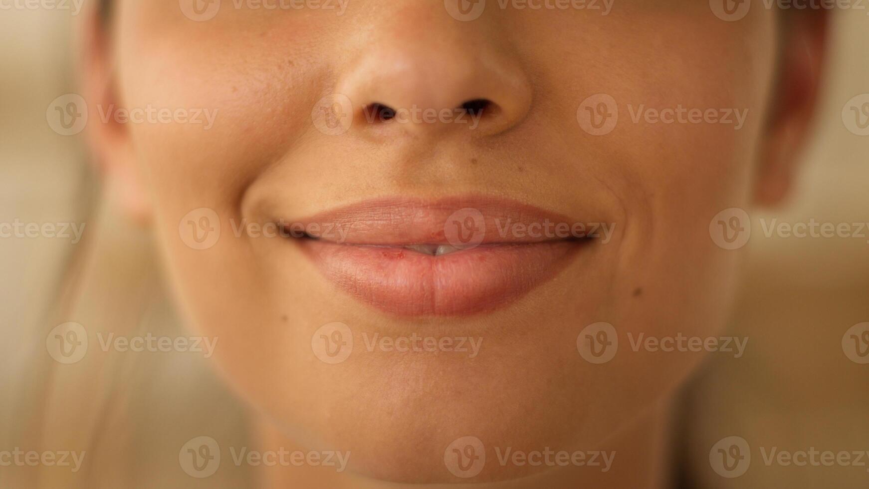 Close up face lips of unrecognizable Indian Arabian woman girl female lady smiling smile sensuality plastic surgery beauty lipstick make up health medicine cropped view indoors feminine cosmetology photo