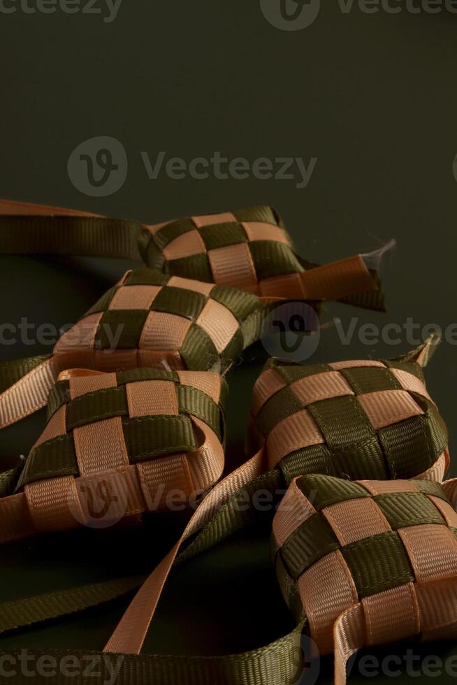 a group of four green and tan woven bags photo