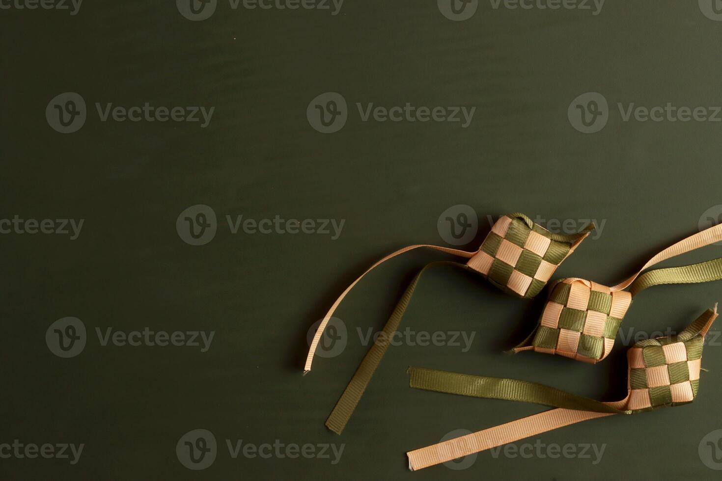 two green and brown ribbons on a dark background photo