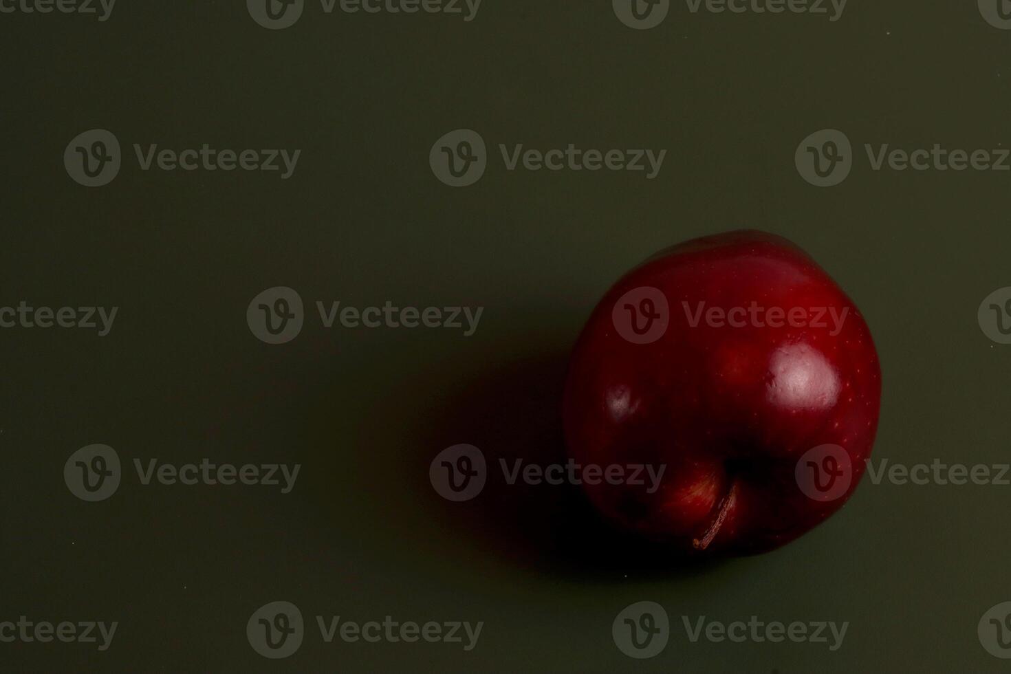 a red apple on a table eid chinese photo
