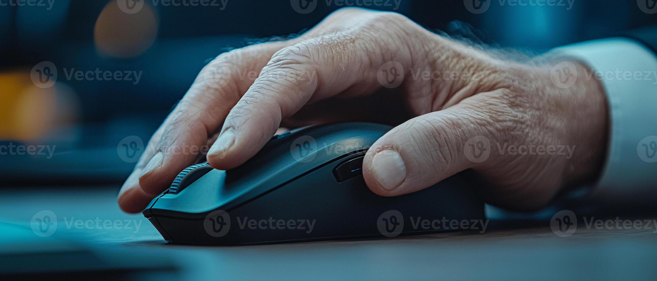 Close-Up of a Hand Gripping a Computer Mouse in a Professional Setting photo
