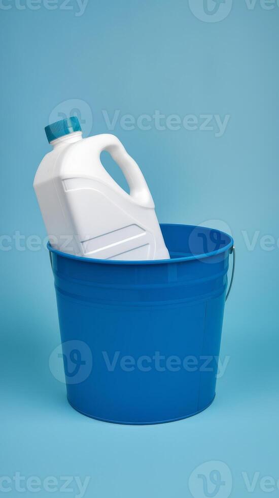 A blue bucket with a white jug in it photo