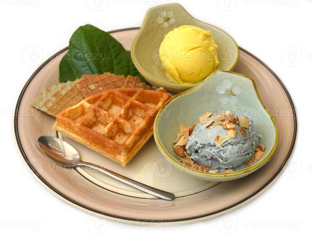 Two scoops of organic ice cream with Belgium waffle isolated on white background photo