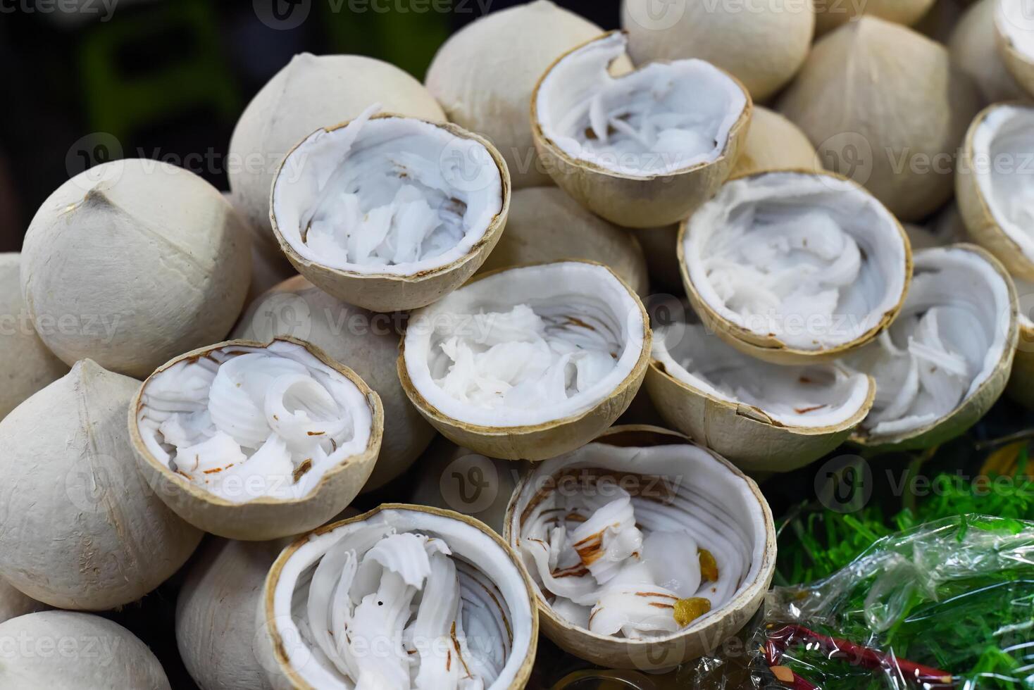 Halves with young coconut for preparation of ice cream in vietnam photo