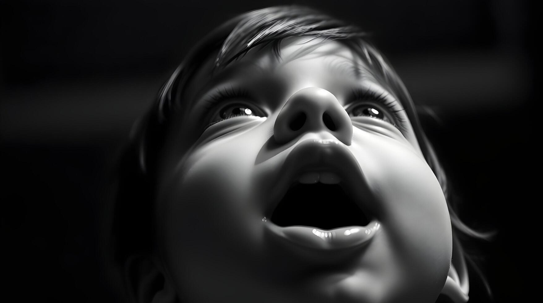 A black and white photo of a child with its mouth open