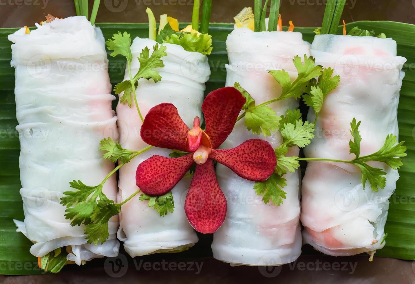 Vietnamese Pho spring roll with sea food, tofu, vegetables isolated on black background for a menu photo