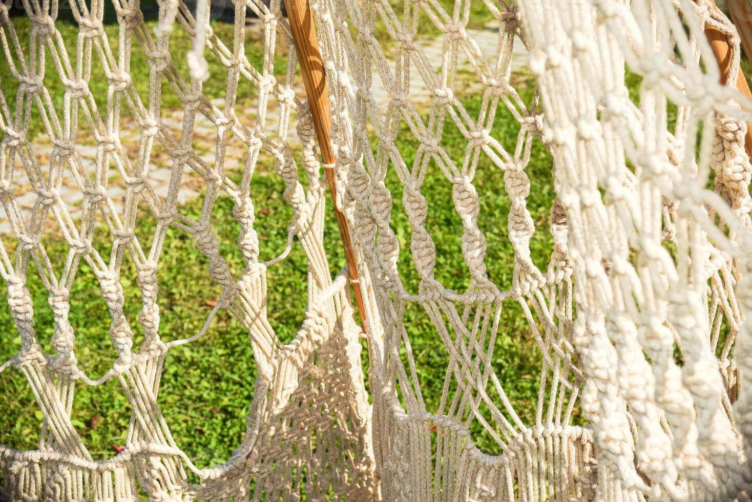 Various knots of macrame made of white threads photo