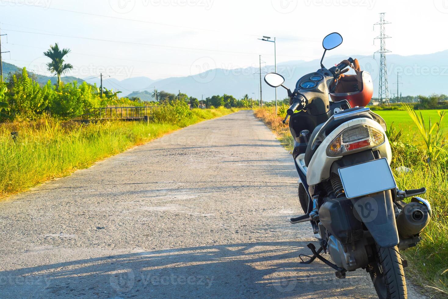 motorbike on the road among rice fields in Vietnam photo