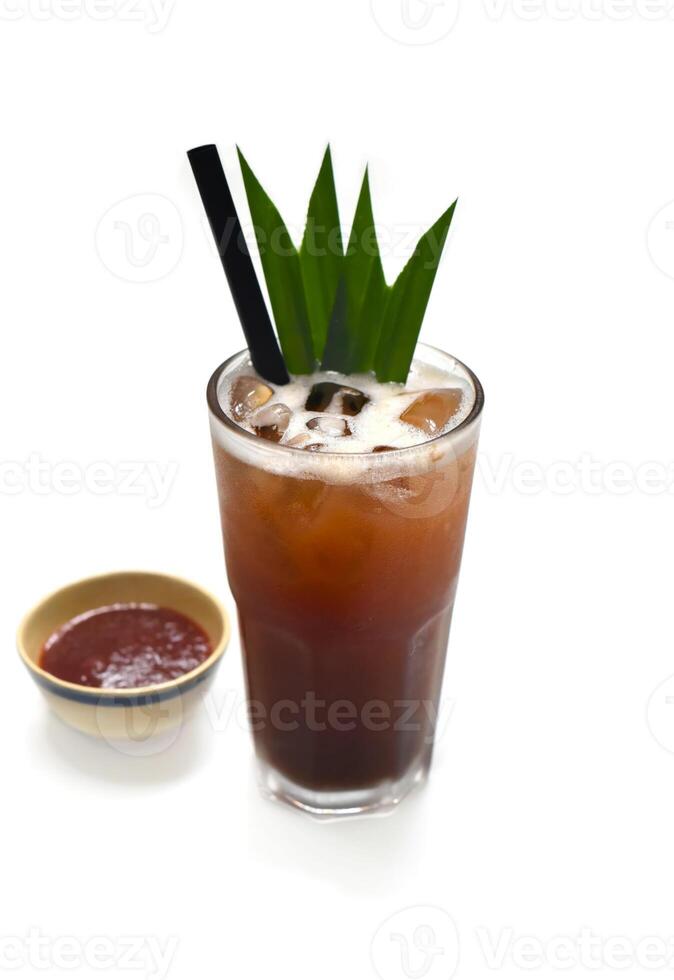 Iced plum tea with jam isolated on white background photo