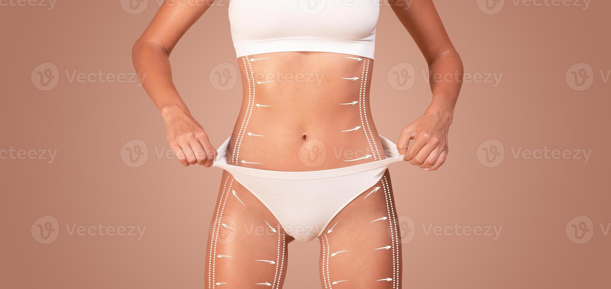 A woman engages in body sculpting and contouring, focusing on feminine curves and pampering her skin. This activity highlights her dedication to wellness and weight loss. photo