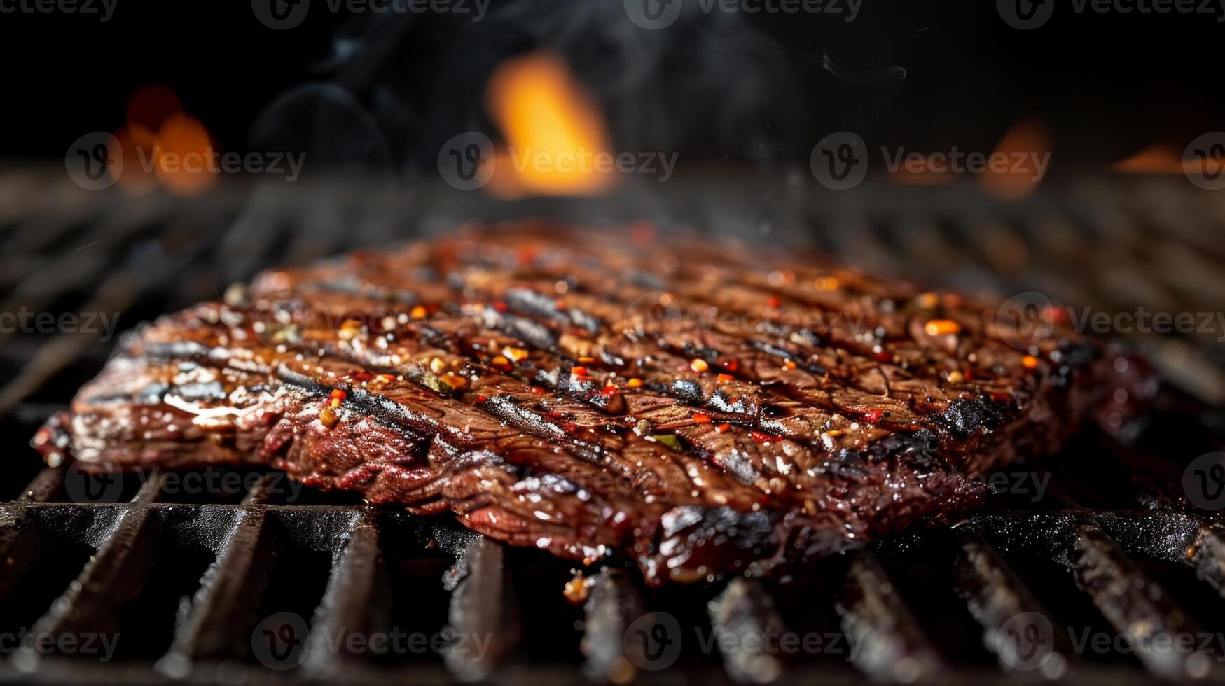 Juicy steak is being grilled on a barbecue with visible grill marks and spices. Smoke wafts around, creating an inviting outdoor atmosphere during a summer gathering. photo