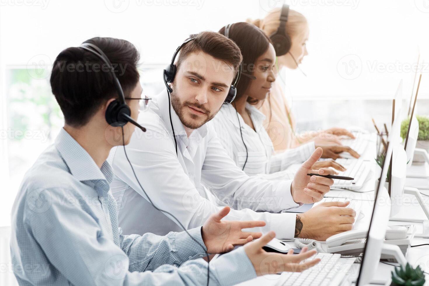 Customer support department team at work in call center office photo