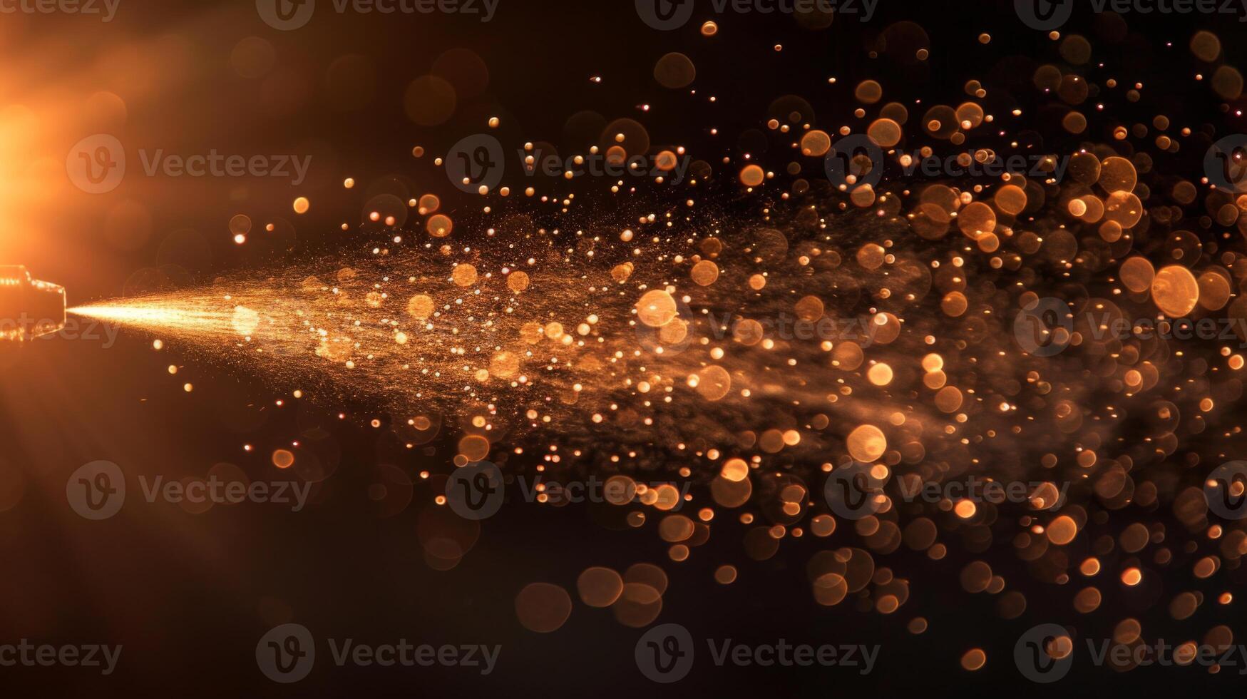 A stream of golden particles is released in a dark environment, creating a captivating effect as light rays highlight the sparkling mist during an art performance. photo