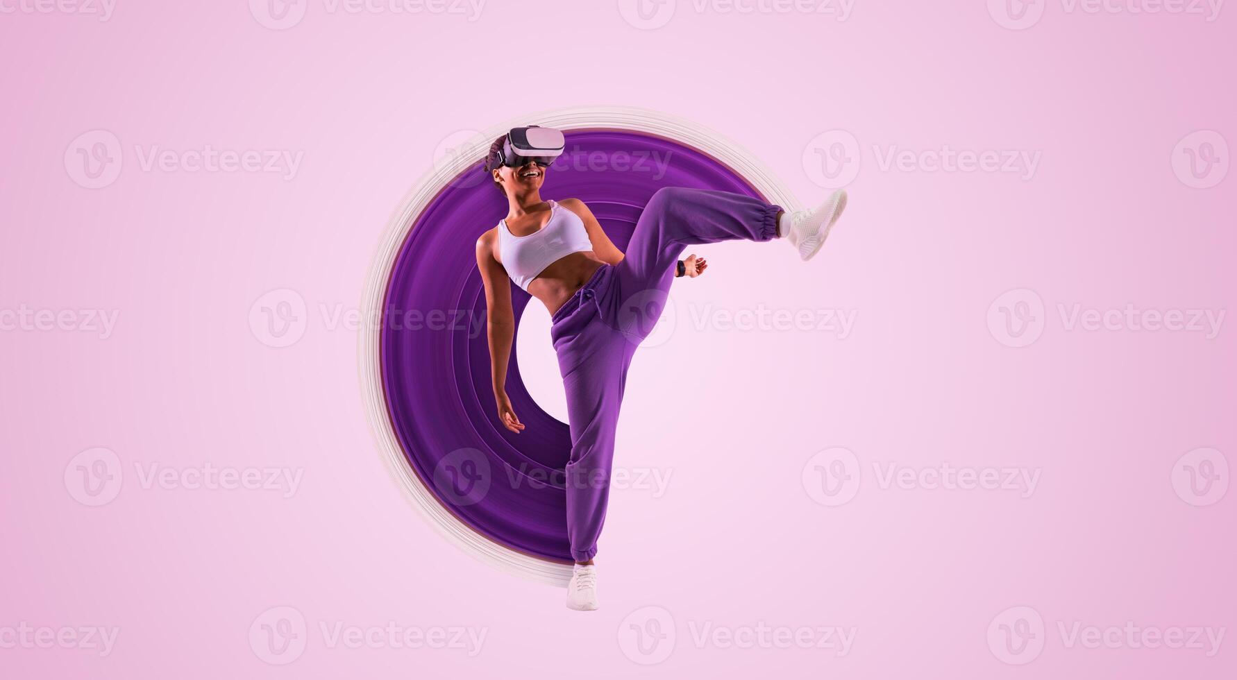 Fitness in digital age. African American woman exercising in the metaverse while wearing virtual reality headset on pink neon background. Lady throwing a kick mid air and exploring virtual games photo