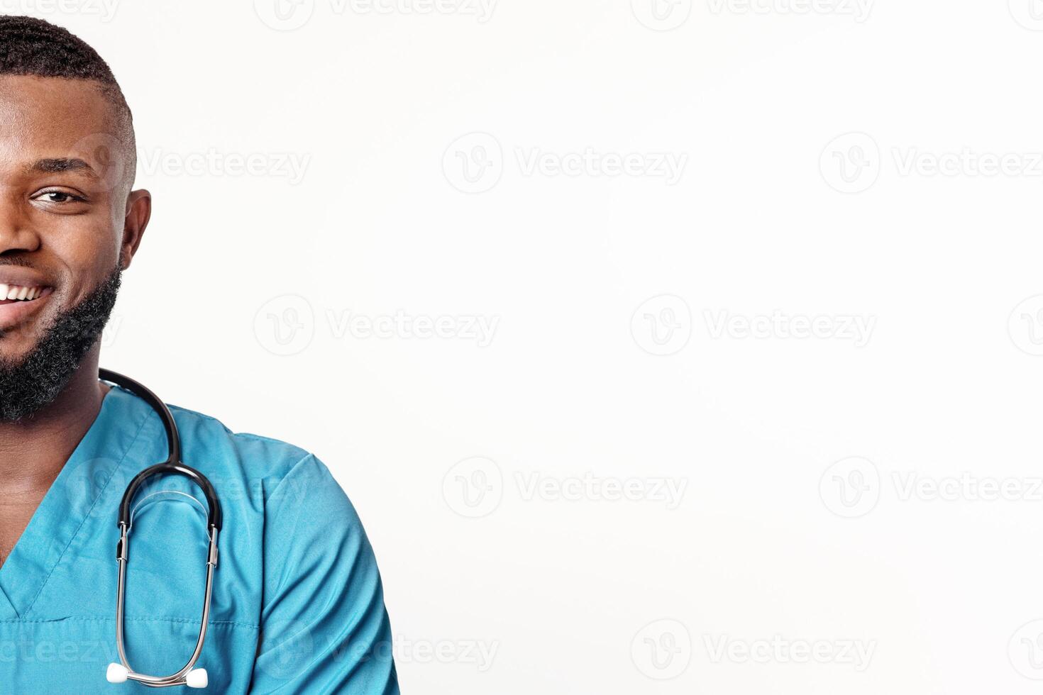 Visit new modern clinic. Close up portrait of smiling african american doctor over white studio background, panorama with empty space photo