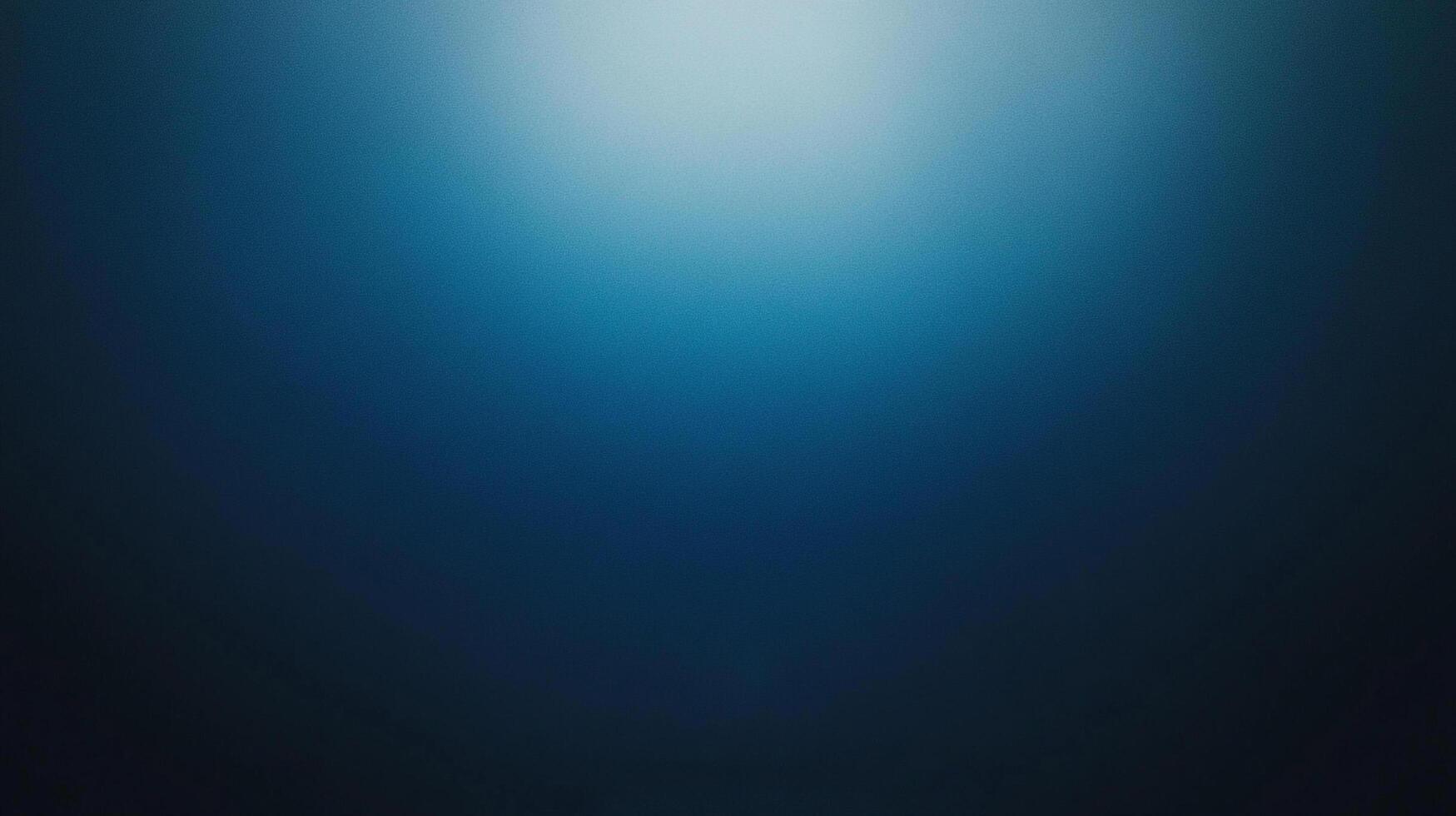 A deep blue background featuring smooth gradients, creating an abstract and tranquil atmosphere that evokes feelings of calmness and introspection. photo