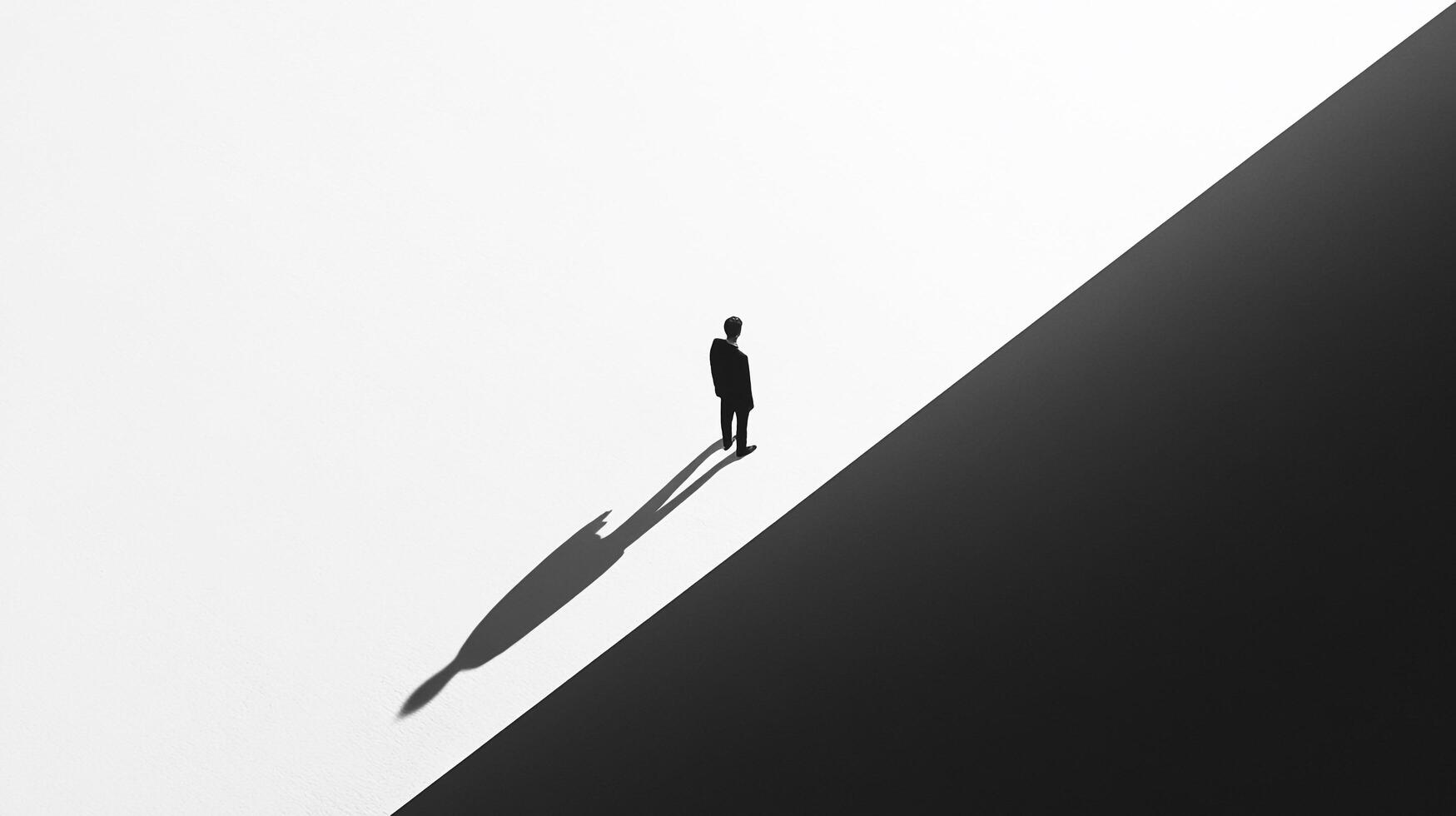 A lone figure stands atop a stark division of light and dark, symbolizing choices, balance, and the dichotomy faced by individuals in their life journeys. photo