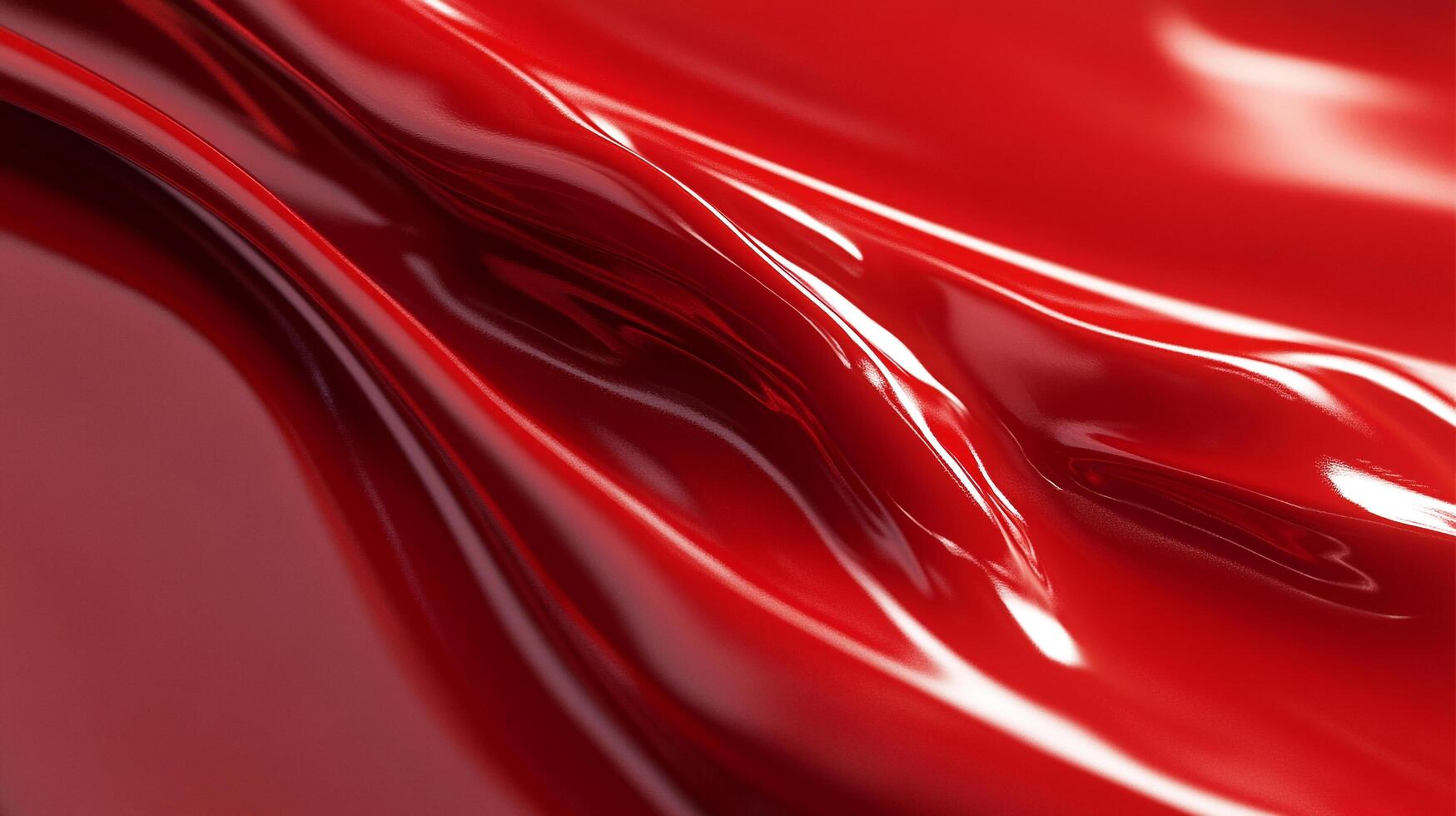 This image features a glossy red surface, flowing gracefully with light reflections that create a sense of movement and vivid color for visual appeal. photo
