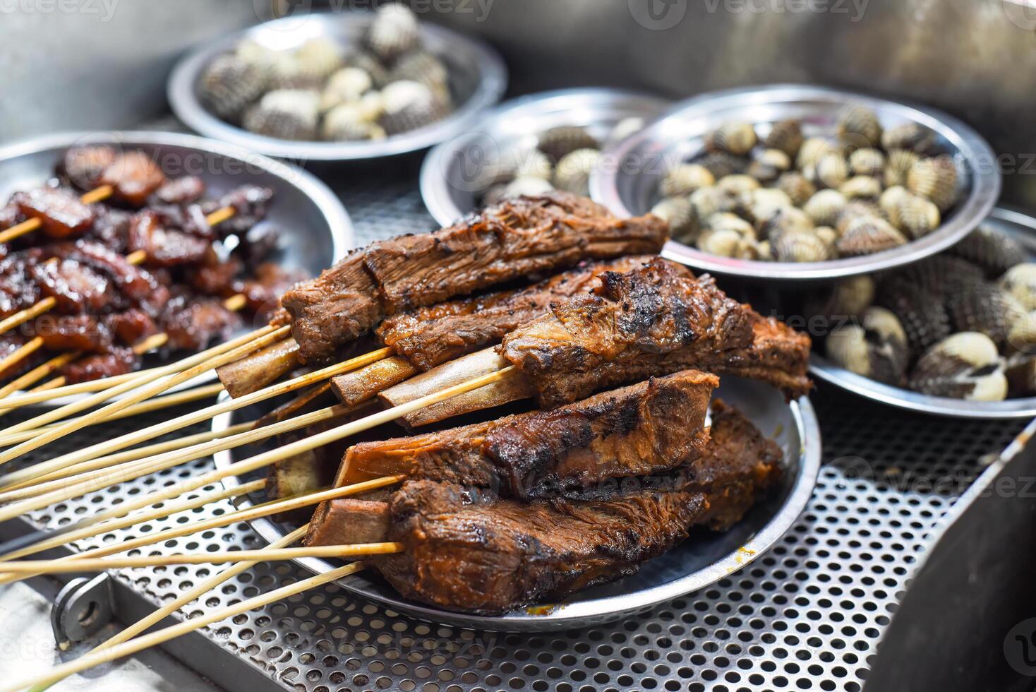 Grilled beef ribs bbq in Jalan Alor street food in Kuala Lumpur photo
