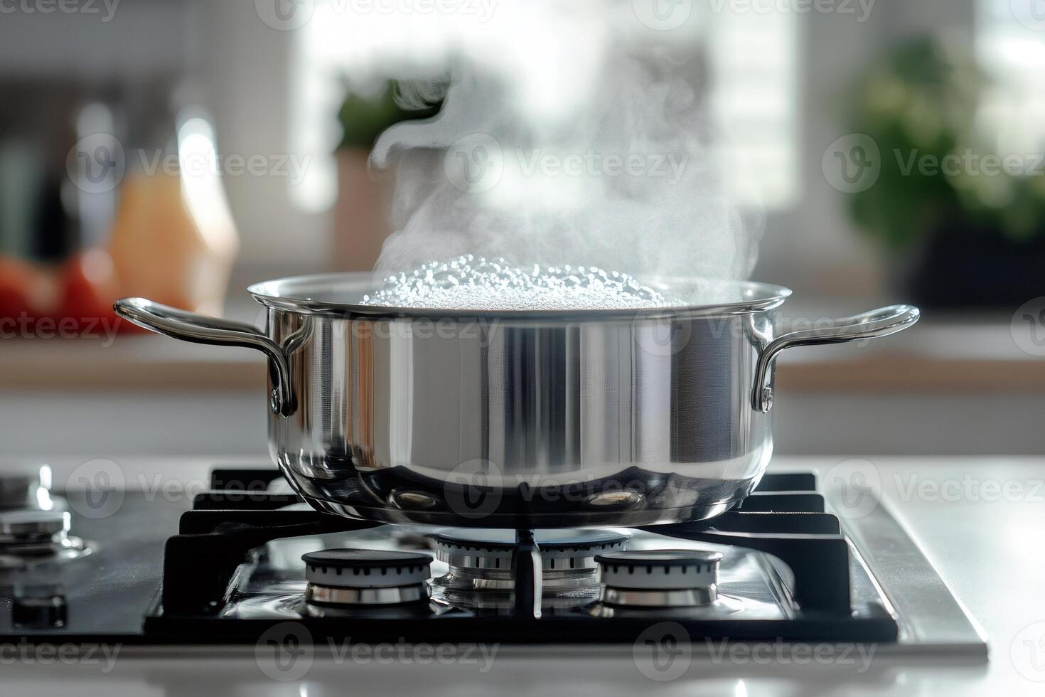 Steaming pot boiling water on stove in kitchen photo