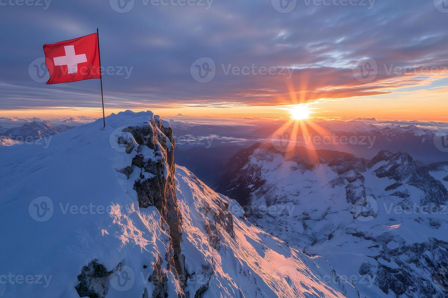 Swiss flag waving on a snowy mountain peak at sunrise photo