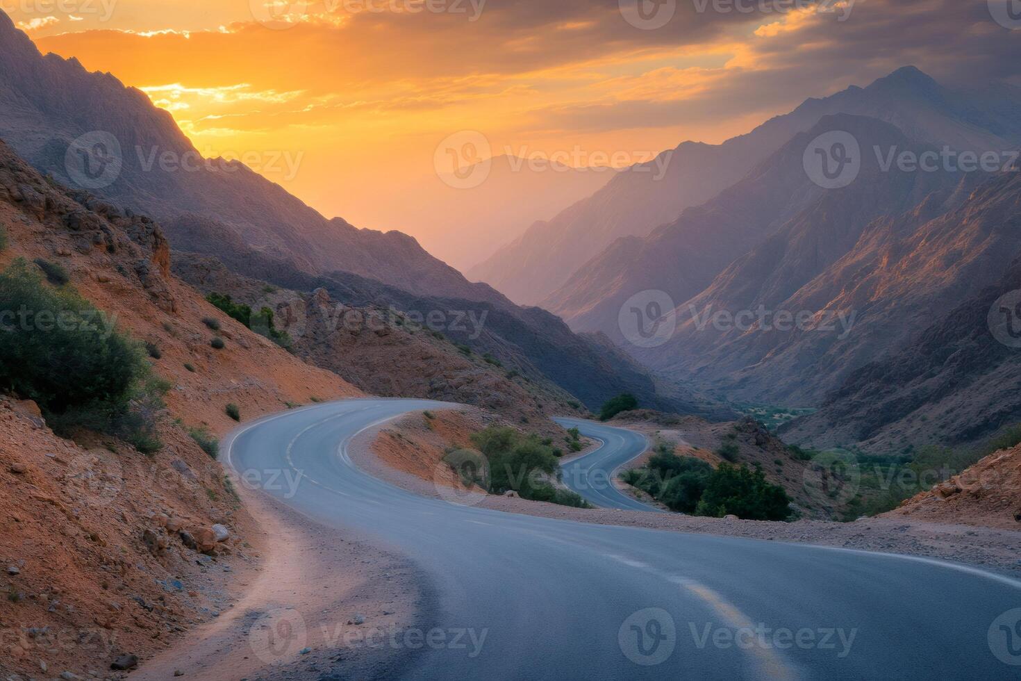 Winding mountain road during sunset in the High Atlas Mountains, Morocco photo