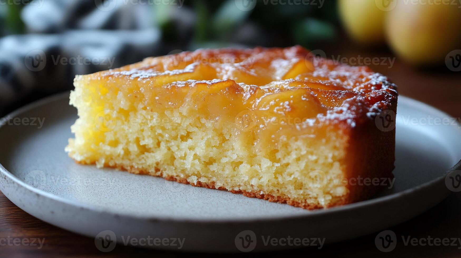 Slice of pear and almond cake resting on a plate photo