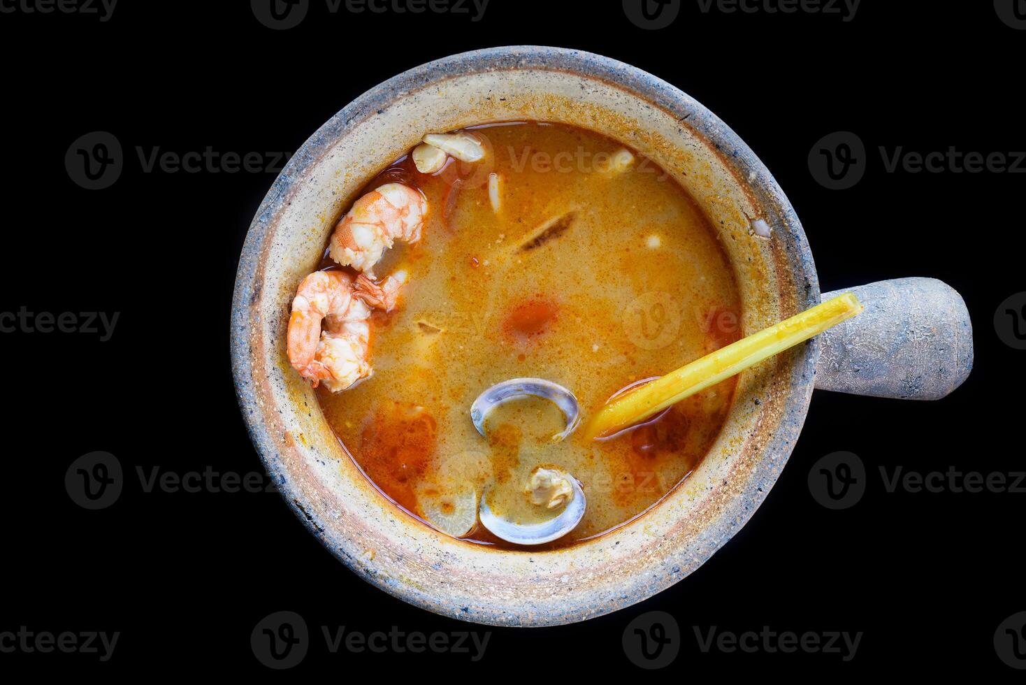 Soup tom yum with tomato and mussels top view. photo