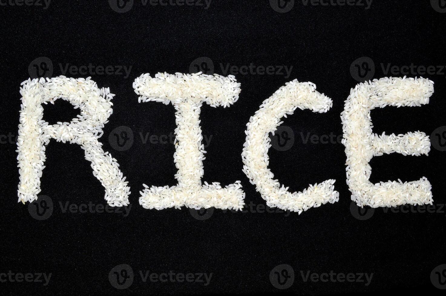 Word arts Rice made of rice grain on black background photo